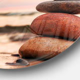 Stones Pyramid on Sand Symbolizing Zen' Landscape Metal Circle Wall Art