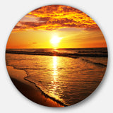 Bright Yellow Sunset over Waves' Beach Metal Circle Wall Art