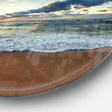 Sunrise and Glowing Waves in Ocean' Seascape Metal Circle Wall Art